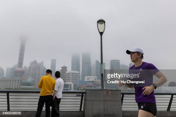 Man runs along The Bund on June 01, 2022 in Shanghai, China.