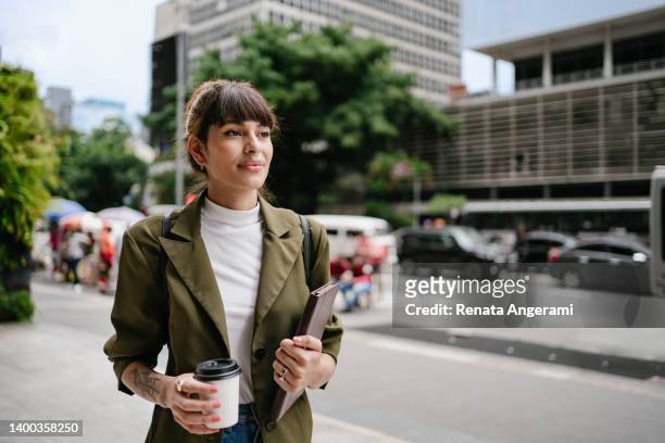 business woman with tablet and coffee at paulista avenue in sao paulo , brazil - south american culture stock pictures, royalty-free photos & images