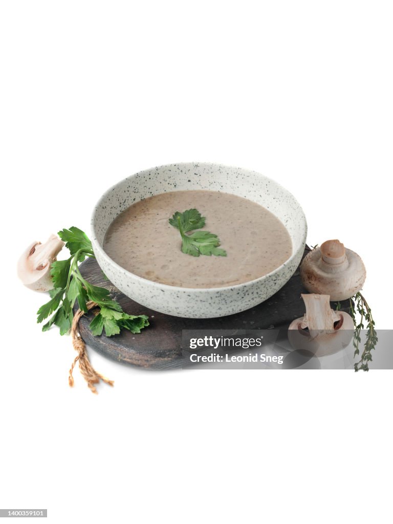 Creamy mushroom puree soup on white background isolated