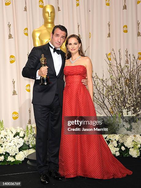 Actress Natalie Portman poses with Jean Dujardin , winner of the Best Actor Award for 'The Artist,' in the press room at the 84th Annual Academy...