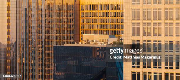 berlin city symmetry business buildings with sun light - light burst abstract centre stock-fotos und bilder