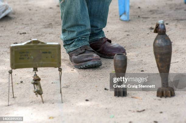 The Britsh mine clearnace charity HALO Survey Team displays unexploded bombs and landmines as part of an information talk to the villagers of Tlemo,...