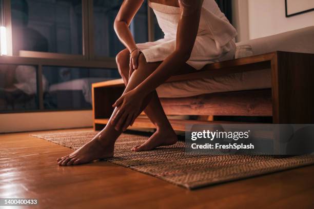anonymous woman applying cream on her body - traditional ceremony stock pictures, royalty-free photos & images