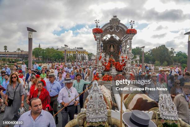 The simpecado of the Brotherhood of Seville over the bridge of San Telmo, starting its pilgrimage to the village of El Rocio on June 1, 2022 in...