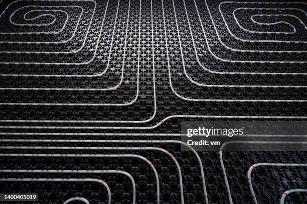 underfloor heating pipes on dark background - leg wound stockfoto's en -beelden