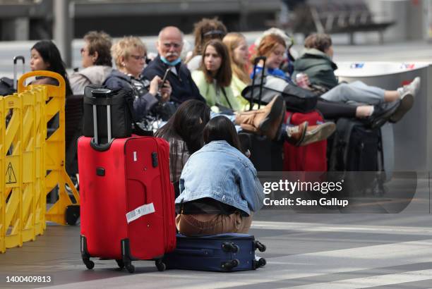 Travellers wait on a platform for a regional train on the first validity day of the new 9 Euro monthly rail ticket of German state railways Deutsche...