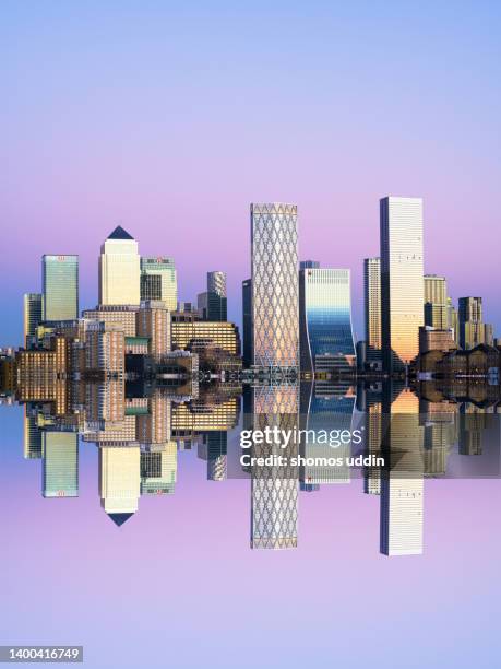 london canary wharf skyline reflection - composite image - sunset on canary wharf stock pictures, royalty-free photos & images