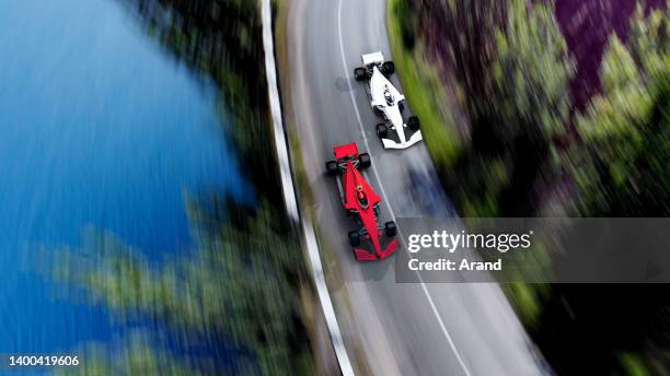 red race car leading on a race track - formula 1 stockfoto's en -beelden