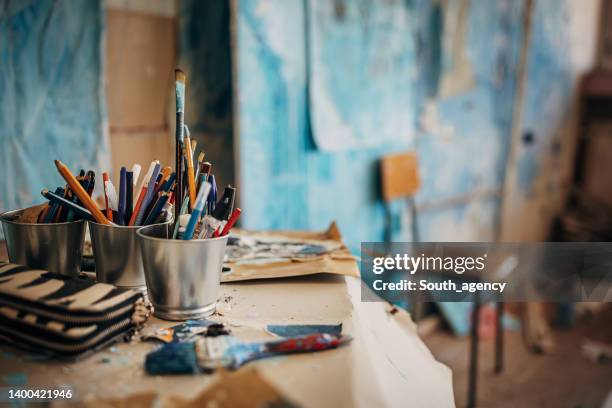 messy art studio - artist studio stock pictures, royalty-free photos & images