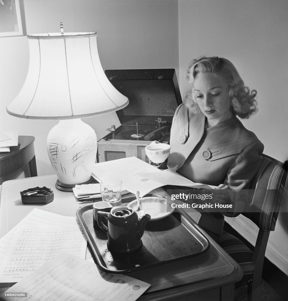 Ina Ray Hutton Color American singer and bandleader Ina Ray Hutton holding a coffee cup as ...
