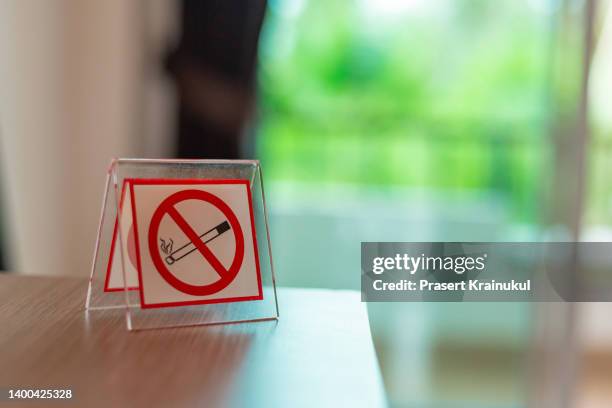 no smoking sign on table in hotel - house rules stock pictures, royalty-free photos & images