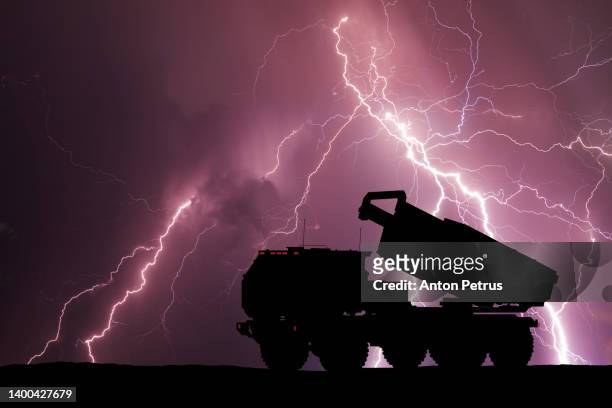 multiple launch rocket system on the background of stormy sky with lightning - ukraine war bildbanksfoton och bilder