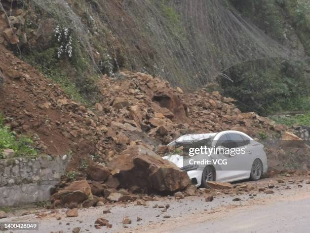 Car is buried in landslide rubble following an earthquake on June 1, 2022 in Lushan County, Ya an City, Sichuan Province of China. A 6.1-magnitude...