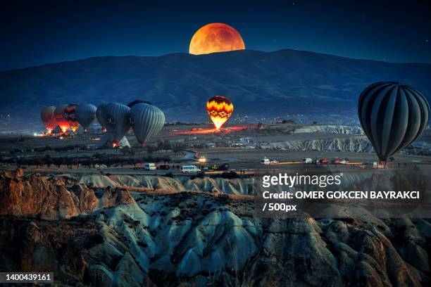 aerial view of hot air balloons flying over sky,kapadokya,turkey - cappadocia hot air balloon stock pictures, royalty-free photos & images