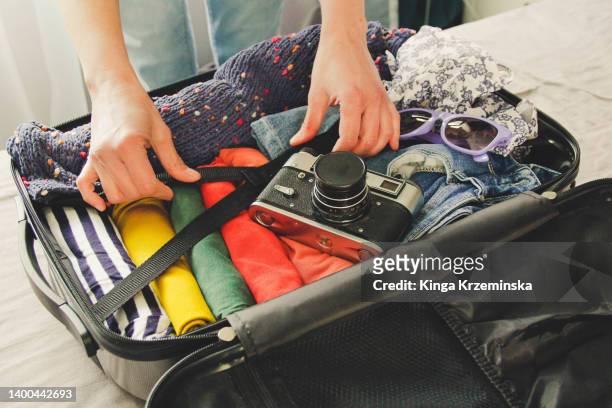 packing a suitcase - strap stock pictures, royalty-free photos & images