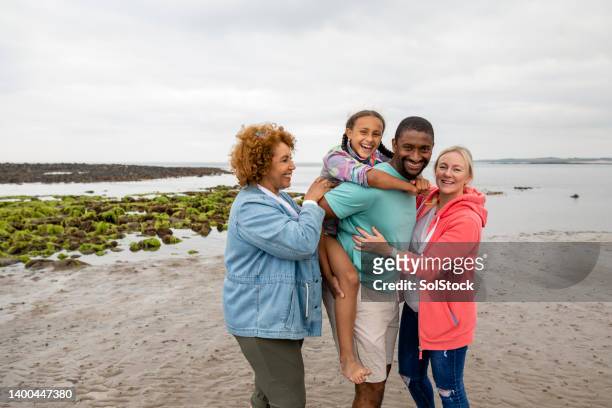 our perfect family - beach black and white stock pictures, royalty-free photos & images