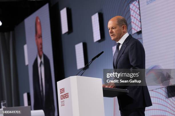 German Chancellor Olaf Scholz speaks at a congress of the BDEW, the Federal Association of the Energy And Water Sector, on June 1, 2022 in Berlin,...