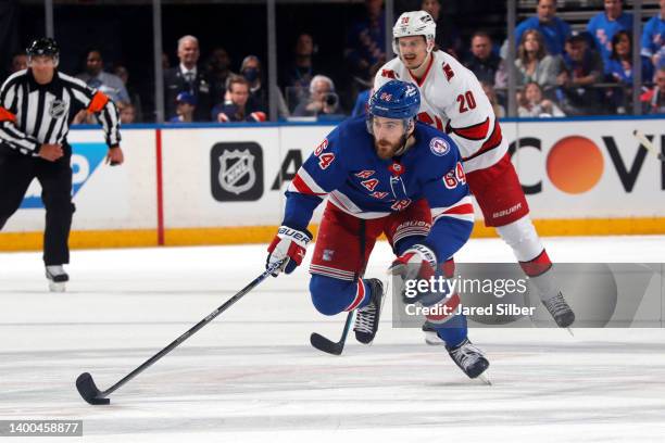 Tyler Motte of the New York Rangers skates with the puck against the Carolina Hurricanes in Game Six of the Second Round of the 2022 Stanley Cup...