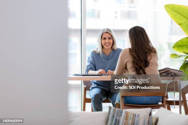 adult woman interviews for a marketing position - interview imagens e fotografias de stock