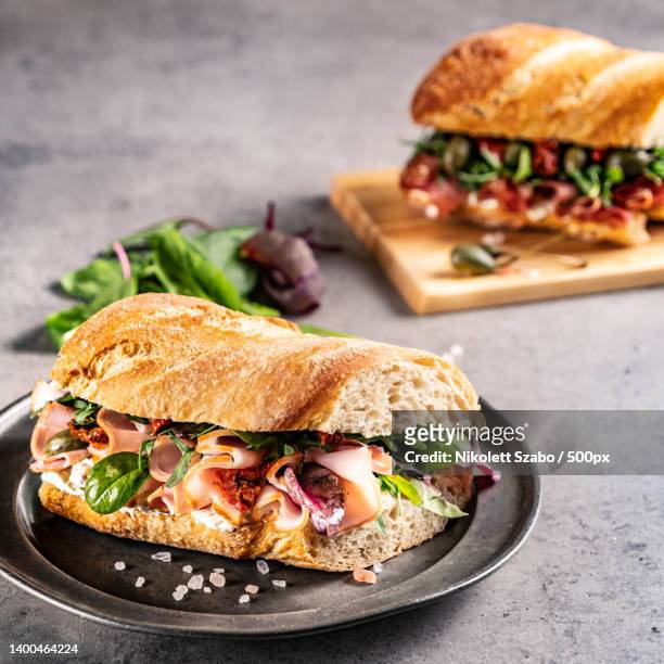 close-up of burger on table - ciabatta stock-fotos und bilder