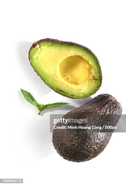 close-up of avocados against white background - brutal honesty stock pictures, royalty-free photos & images