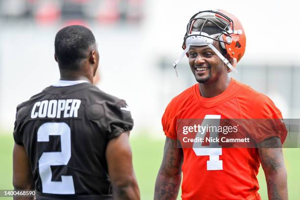 Deshaun Watson of the Cleveland Browns talks with Amari Cooper during the Cleveland Browns offseason workout at CrossCountry Mortgage Campus on June...