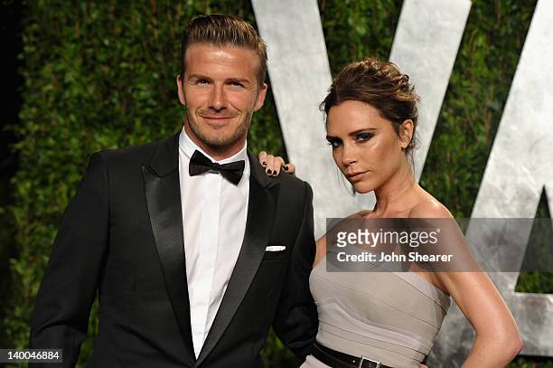 Athlete David Beckham and fashion designer Victoria Beckham arrive at the 2012 Vanity Fair Oscar Party hosted by Graydon Carter at Sunset Tower on...