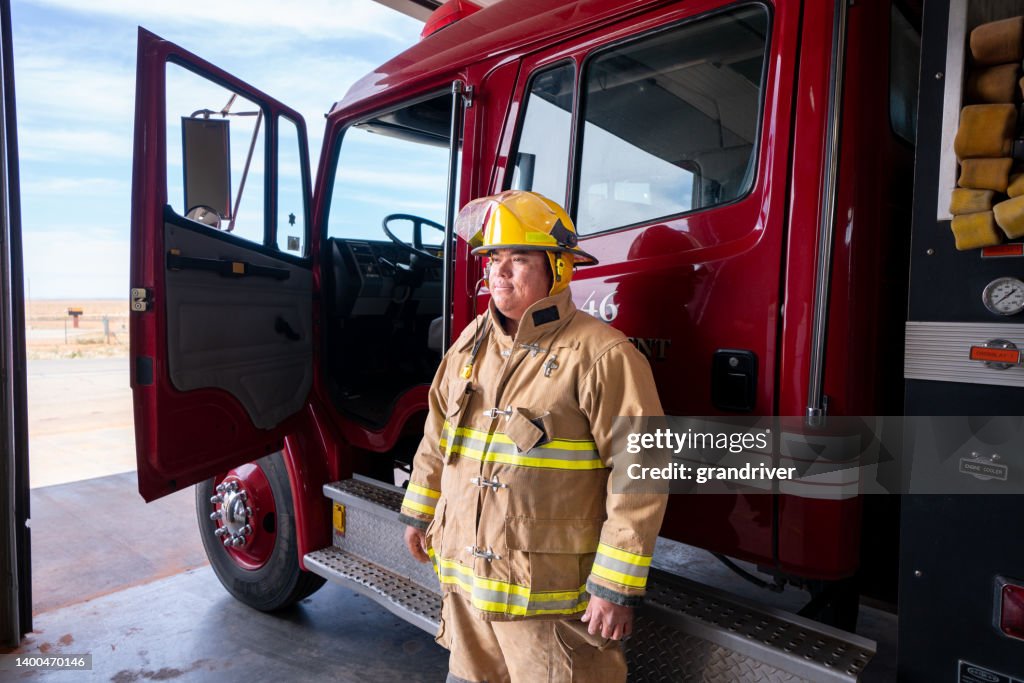 Real Fireman Engine Young Firefighter In The Fire Station In Full Fire Protective Gear ...