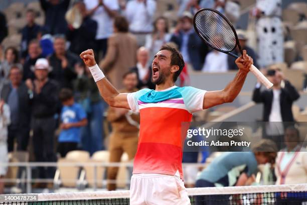 Marin Cilic of Croatia celebrates match point against Andrey Rublev during the Men's Singles Quarter Final match on Day 11 at Roland Garros on June...