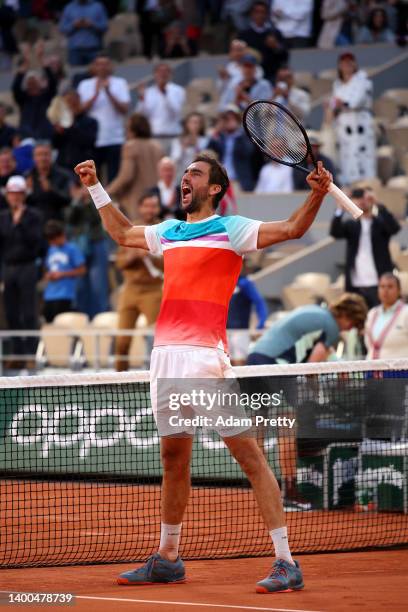 Marin Cilic of Croatia celebrates match point against Andrey Rublev during the Men's Singles Quarter Final match on Day 11 at Roland Garros on June...