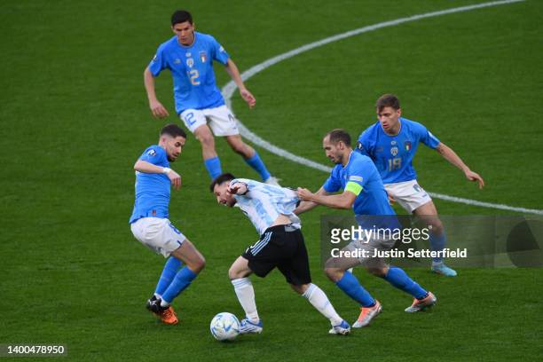 Lionel Messi of Argentina is challenged by Giorgio Chiellini of Italy during the 2022 Finalissima match between Italy and Argentina at Wembley...