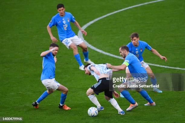 Lionel Messi of Argentina is challenged by Jorginho and Giorgio Chiellini of Italy during the 2022 Finalissima match between Italy and Argentina at...