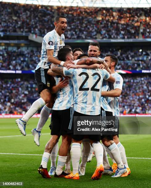 Lautaro Martinez of Argentina celebrates scoring their side's first goal with teammates during the 2022 Finalissima match between Italy and Argentina...