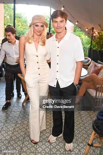 Pixie Lott and Oliver Cheshire attend the celebration for the High Summer Collection with REISS x CHE, hosted by Oliver Cheshire, at The Pavilion...