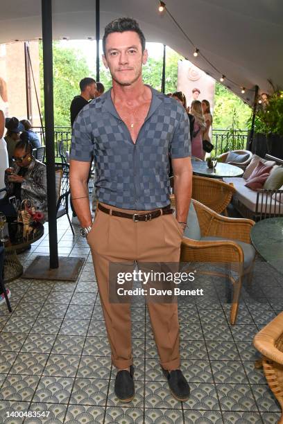 Luke Evans attends the celebration for the High Summer Collection with REISS x CHE, hosted by Oliver Cheshire, at The Pavilion Club on June 01, 2022...