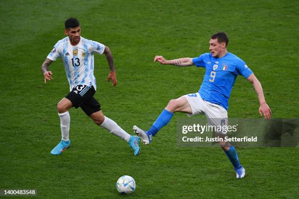 Cristian Romero of Argentina is challenged by Andrea Belotti of Italy during the 2022 Finalissima match between Italy and Argentina at Wembley...