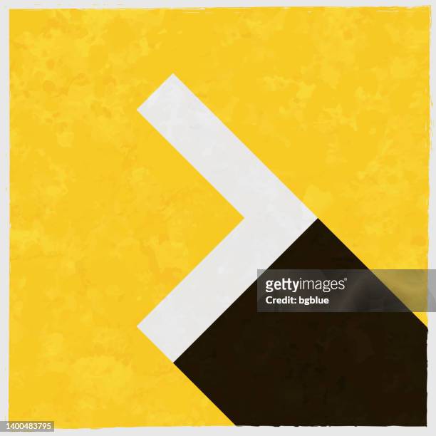 chevron right. icon with long shadow on textured yellow background - chevron icon stock illustrations