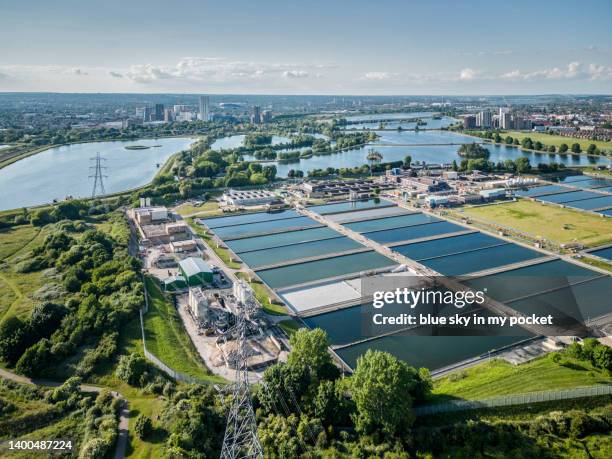 the water treatment works at coppermill lane in north east london. with the recreational reservoirs of the lea valley in the distance. from a drone perspective. - walthamstow fotografías e imágenes de stock