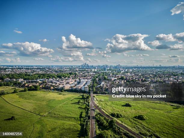 walthamstow marshes, east london.  looking south west towards the city of london next to the overground rail network. from a drone perspective - walthamstow fotografías e imágenes de stock