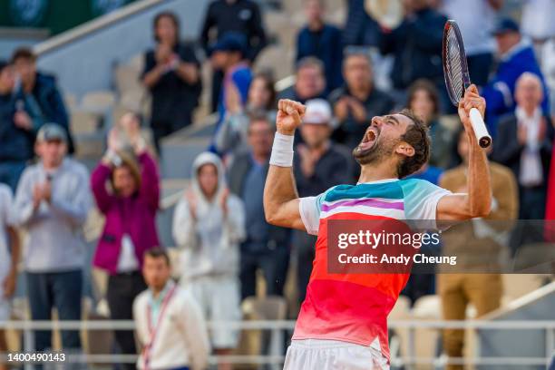 Marin Cilic of Croatia celebrates winning match point against Andrey Rublev during the Men's Singles Quarter Final match on Day 11 at Roland Garros...