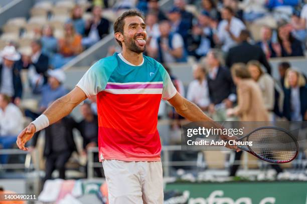 Marin Cilic of Croatia celebrates winning match point against Andrey Rublev during the Men's Singles Quarter Final match on Day 11 at Roland Garros...