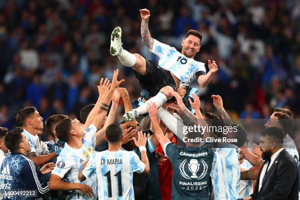 Lionel Messi of Argentina is thrown in the air by their teammates as they celebrate their sides victory in the 2022 Finalissima match between Italy...