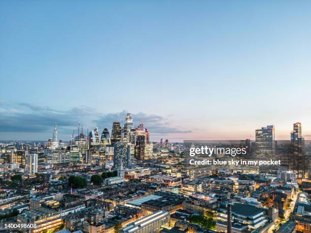 the city of london skyline at dusk from a drone perspective - shoreditch fotografías e imágenes de stock