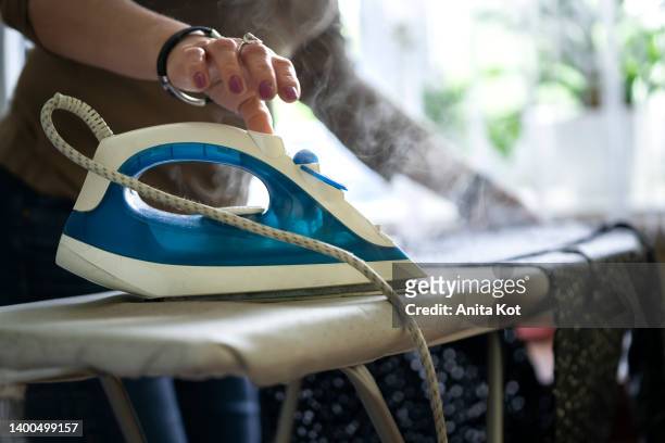ironing clothes - ferro da stiro foto e immagini stock
