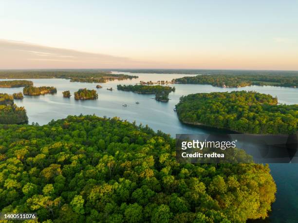 sunrise on  the  thousand islands new york state and ontario canada - ontario canada stock pictures, royalty-free photos & images