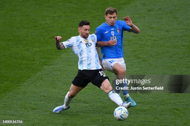 Lionel Messi of Argentina is challenged by Nicolo Barella of Italy during the 2022 Finalissima match between Italy and Argentina at Wembley Stadium...