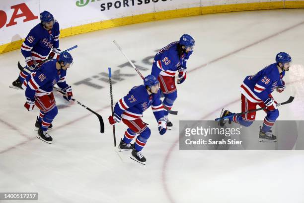 Chris Kreider of the New York Rangers skates with his teammates after scoring a goal on Andrei Vasilevskiy of the Tampa Bay Lightning during the...