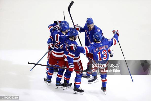 Filip Chytil of the New York Rangers celebrates with his teammates after scoring a goal on Andrei Vasilevskiy of the Tampa Bay Lightning during the...