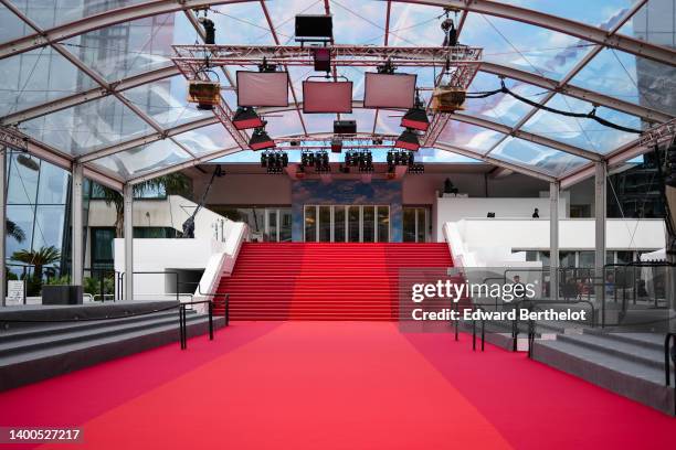 General view of the empty red carpet at the Palais des Festivals et des Congres, during the 75th annual Cannes film festival on May 23, 2022 in...