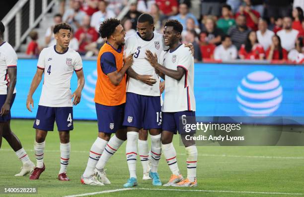 Weson McKennie celebrates with Haji Wright and Yunus Musah of the United States after Wright sored a second half goal against Morocco at TQL Stadium...